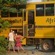 Big yellow truck with people from local villages 
